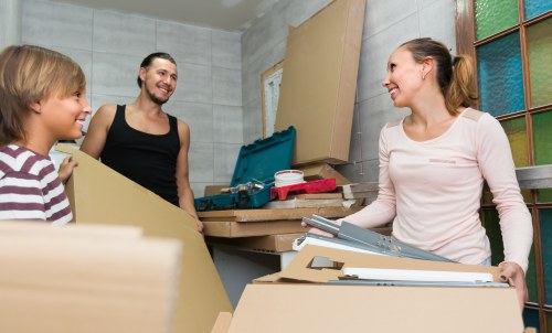 Staff using PPE while handling furniture during a local move