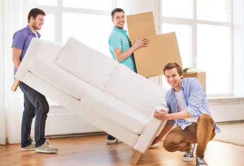 Professional movers loading furniture for a home move in Chislehurst
