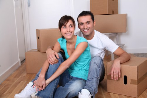 Packed boxes and furniture ready for loading by local movers
