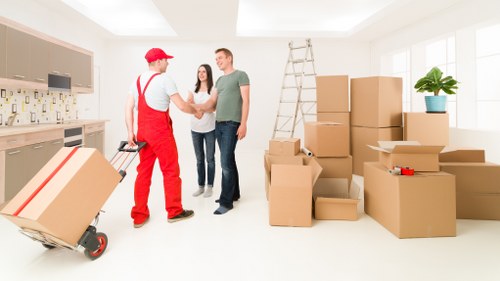 Local removalists handling furniture in a Chislehurst residential street