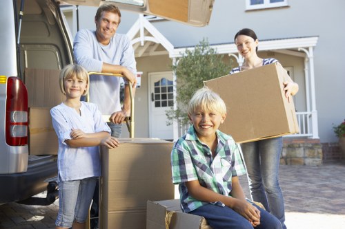 Team collecting bulky household furniture from a local home