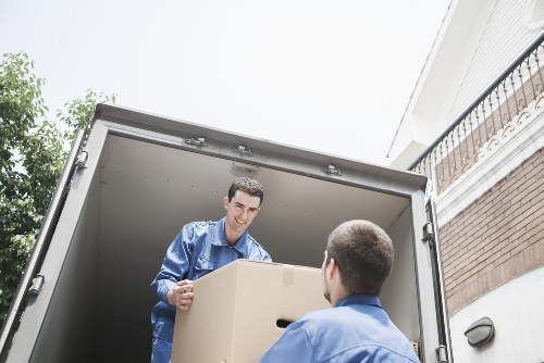 Professional movers loading a van for a local move in Chislehurst