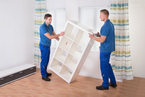 Furniture and boxes being transported by a man and van service